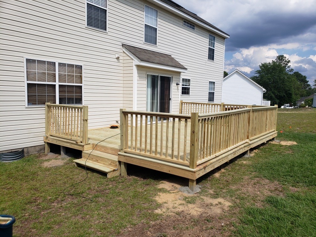 Wooden patio deck in a residential neighborhood.