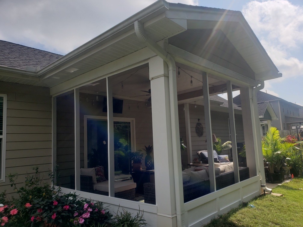 Screened patio in a residential neighborhood.